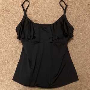 Stretchy black top with ruffle, size L, built in bra;